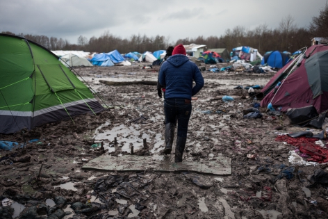 Camp de Grande-Synthe 10 janvier 2016, France, camp de réfugiés de Grande-Synthe. Le camp est complètement envahie par la boue. À certain endroit, elle arrive jusqu'aux mollets des réfugiés.